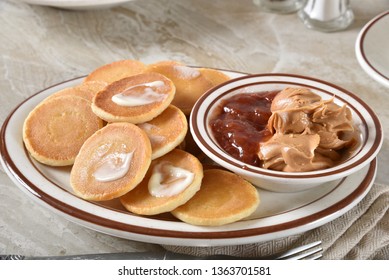 Fresh Mini Pancakes With Peanut Butter And Strawberry Jam