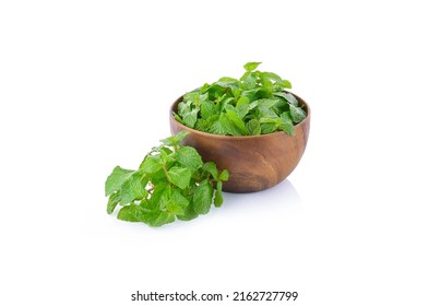 Fresh Mint Leaves In Wooden Bowl Isolated On White Background