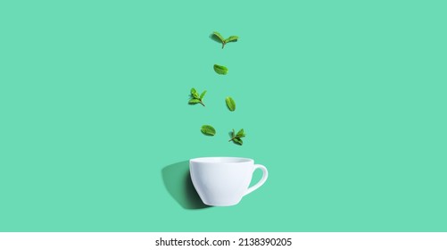 Fresh Mints With Tea Cup Overhead View - Flat Lay