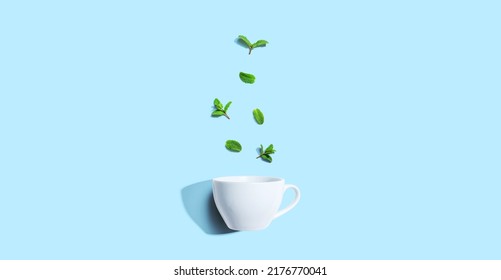 Fresh Mints With Tea Cup Overhead View - Flat Lay