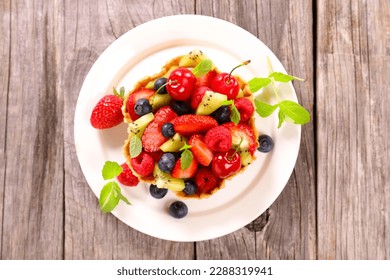 fresh mixed fruits salad ( straberry, cherry, blueberry and kiwi fruit)
