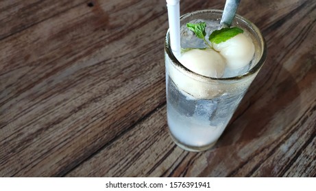 A Fresh Mojito Lychee Drink Served With Mint Leaves