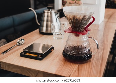Fresh morning filter coffee blooming in the dripper - Shutterstock ID 623916353