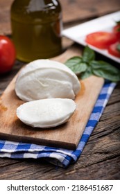 Fresh Mozarella Cheese On Cutting Board Close Up