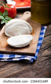 Fresh Mozarella Cheese On Cutting Board Close Up