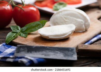 Fresh Mozarella Cheese On Cutting Board Close Up