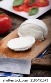 Fresh Mozarella Cheese On Cutting Board Close Up