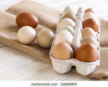 Fresh Multi-color Farm Eggs On The Table.