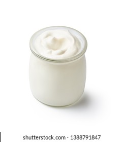 Fresh natural homemade organic yogurt in a glass jar isolated on white background