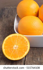 Fresh Navel Oranges In White Bowl On Wood Backgrond