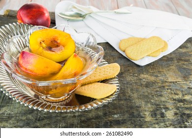 Fresh Nectarines In Sweet Honey, Vanilla And Whiskey Sauce With Shortbread On Wooden Background