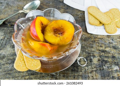 Fresh Nectarines In Sweet Honey, Vanilla And Whiskey Sauce With Shortbread On Wooden Background