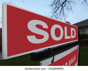 Fresh New Sign Sold In Front Of Detached House In Residential Area. Real Estate Bubble, Crash, Hot Housing Market, Overpriced Property, Overpaid, Buyer Activity Concept. Selective Focus.