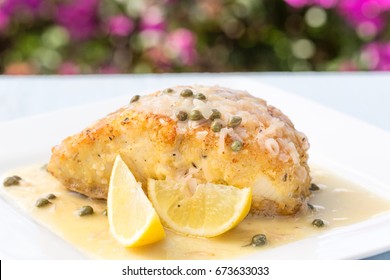 Fresh Ono, or Wahoo, sauteed in a macadamia nut crust with capers and lemon sauce