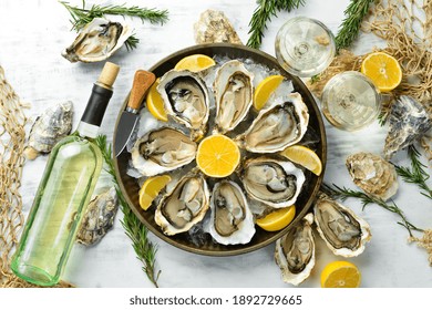 Fresh Opened Oysters And White Wine And Lemon. Free Space For Your Text. Seafood. Flat Lay.