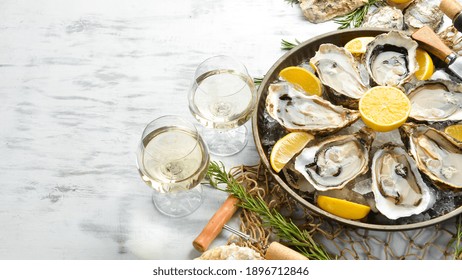 Fresh Opened Oysters And White Wine And Lemon. Free Space For Your Text. Seafood. Flat Lay.