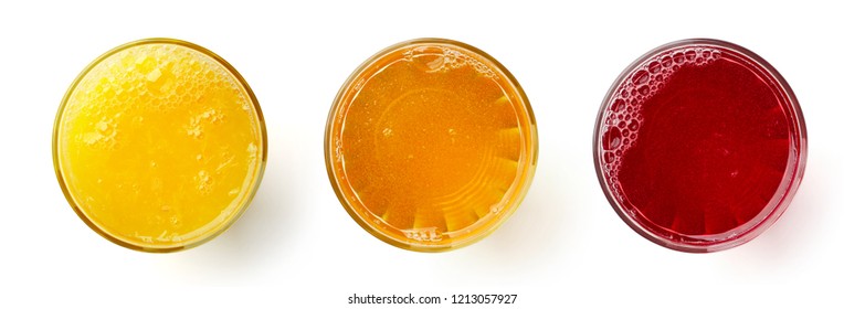 Fresh orange apple and crannberry juices in glasses isolated on white background, top view