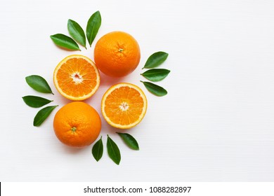 Fresh Orange Citrus Fruit With Leaves Isolated On White Wooden Background.  Top View