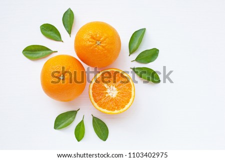Fresh orange citrus fruit  with leaves on white  background. Juicy and sweet and renowned for its concentration of vitamin C