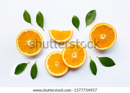 Fresh orange citrus fruit with leaves on white background