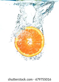 Fresh Orange Falling In Water