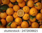 fresh orange fruits with leaves as background top view