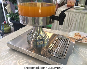 Fresh Orange Juice In Beverage Dispenser. Summer Drink Party.