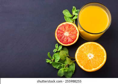 Fresh Orange Juice On Dark Background, Top View, Copy Space