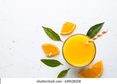 Fresh Orange Juice Smoothie In Glass And Fresh Citrus Around. Healthy Drink On White. Top View.