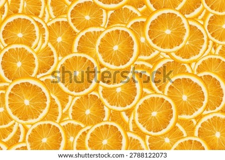 Fresh orange slices pattern background. Citrus fruit texture with juicy round pieces arranged closely together. Healthy food wallpaper with vibrant natural colors.