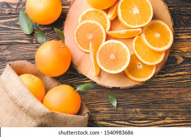 Fresh Oranges On Wooden Table