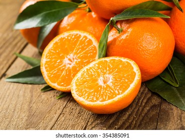 Fresh Oranges On A Wooden Table