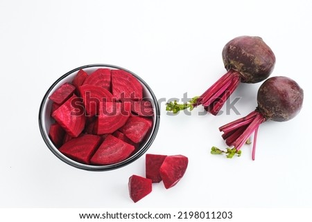 Fresh Organic Beetroot Slices served in a bowl on a white background. This fruit is usually made into juice or salad.
