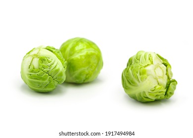 Fresh organic brussels sprouts isolated on white background. Whole vegetables.