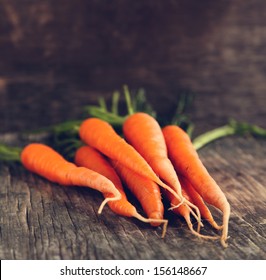 Fresh Organic Carrots on wooden background - Powered by Shutterstock