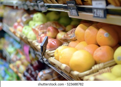 Fresh Organic Fruits And Produce On A Supermarket Shelf In Baskets
