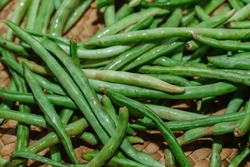 Fresh Organic Green Beans On A Brown Straw Mat.