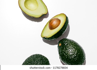 Fresh Organic Hass Avocados On A White Background, Creative Flat Lay Healthy Food Concept