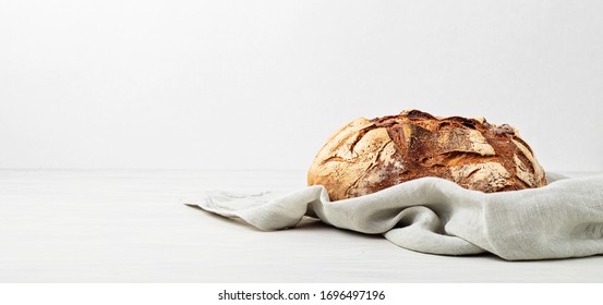 Fresh organic homemade bread. Healthy eating, buy local, homemade bread recipes concept. Copy space. Banner - Powered by Shutterstock