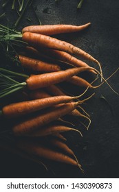 Fresh Organic Nantes Carrots On Dark Background. Healthy Food.