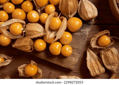 Fresh organic physalis fruit ,Helathy fresh Gooseberry Cape ,Uchuva delicious tropical fruit in Peru, Cape gooseberry (Physalis peruviana) plant on wooden background                   - Powered by Shutterstock