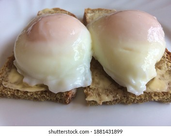 Fresh Organic Poached Eggs On Buttered Brown Soda Bread...