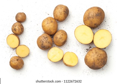 Fresh organic potatoes isolated on white background. Top view