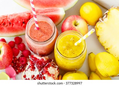 Fresh Organic Red And Yellow Smoothie With Apple, Watermelon, Pomegranate, Raspberry, Pineapple, Banana And Mango. Healthy, Vegan Drinks.