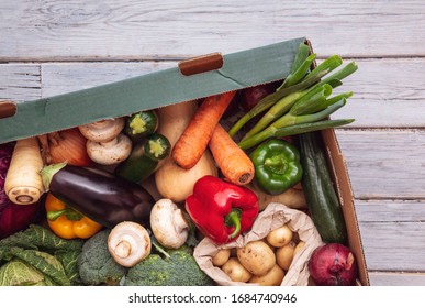 Fresh Organic Vegetable Delivery Box On A Wooden Background