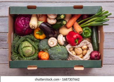 Fresh Organic Vegetable Delivery Box On A Wooden Background