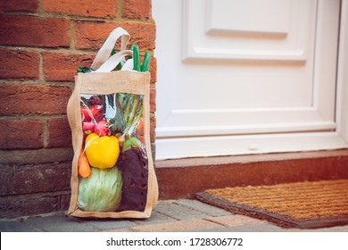 Fresh Organic Vegetable Delivery Concept. Reusable Bio Eco Sackcloth Fabric Bag Packaging Near Brick Wall House Threshold. Local Farmer Healthy Food. Zero Waste And Plastic-free Lifestyle. Copy Space