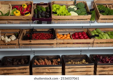 Fresh organic vegetables, greenery in crates on grocery store shelves with price tags mockup. Red yellow bell peppers and cherry tomatoes, zucchini, cabbage. Broccoli, carrots and red onions. Potatoes - Powered by Shutterstock