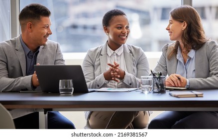 A Fresh Outlook Always Helps. Shot Of A Diverse Group Of Businesspeople Sitting Together In The Office And Having A Meeting.