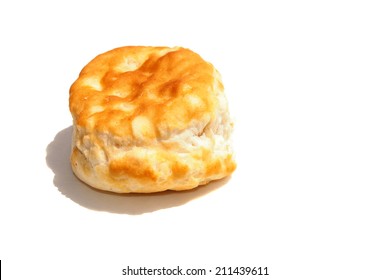 A  Fresh From The Oven Piping Hot Golden Brown Flour Biscuit Isolated On White With Room For Your Text. Flour Biscuits Are Eaten Around The World By Hungry People, With Fried Chicken, Gravy And More.